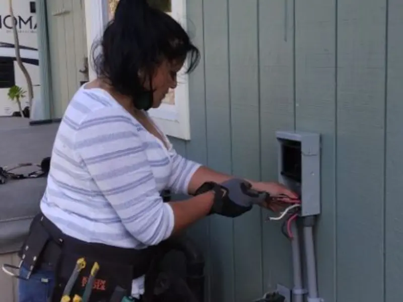 Licensed electrician wiring an exterior subpanel in Colorado City